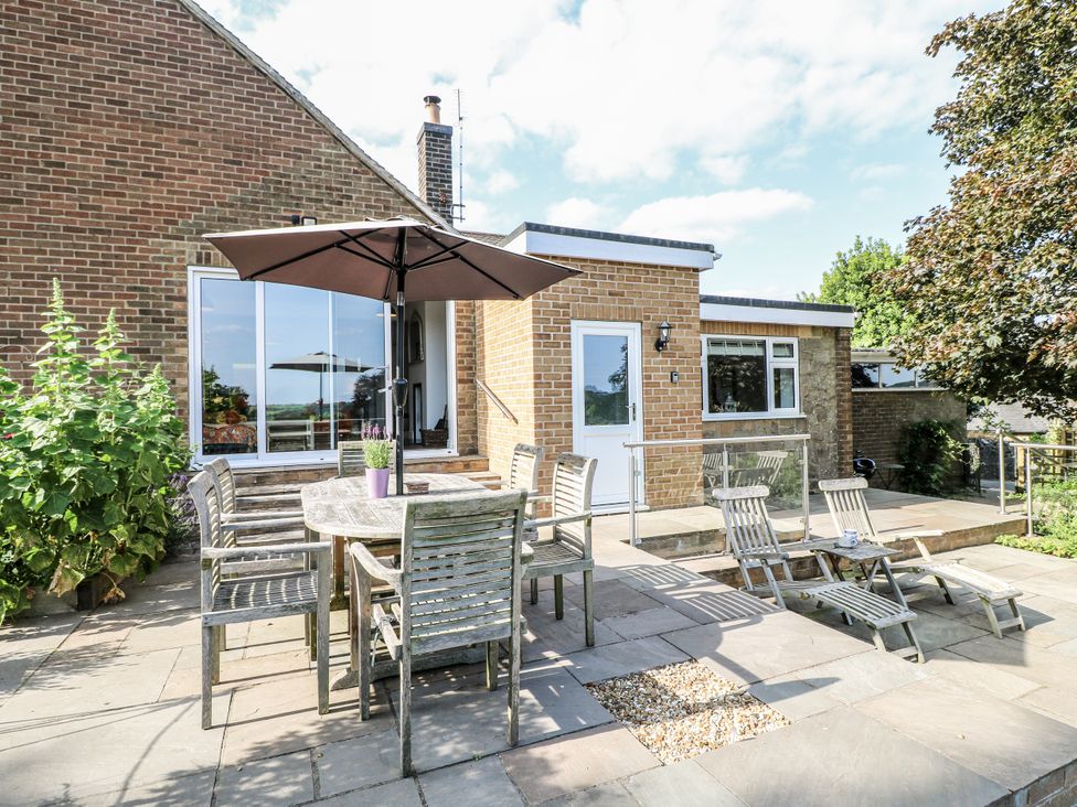 An outdoor dining area with table and chairs at The View @ Orchard View in Hognaston