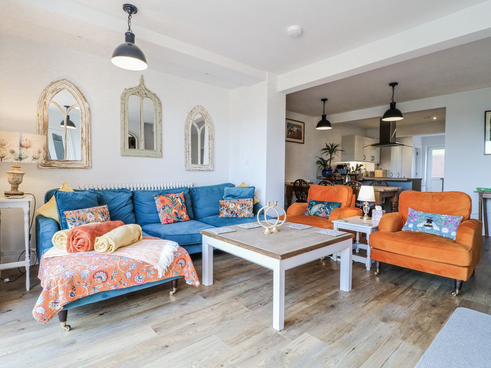 A living room with a sofa and coffee table at The View @ Orchard View in Hognaston