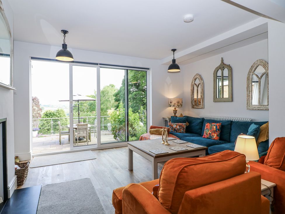 A living room with a sofa and coffee table at The View @ Orchard View Hognaston