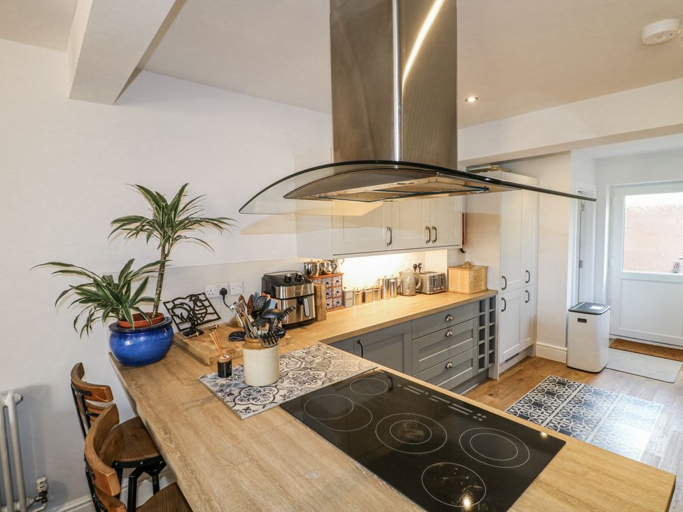 A kitchen with a stove and cabinets at The View @ Orchard View in Hognaston