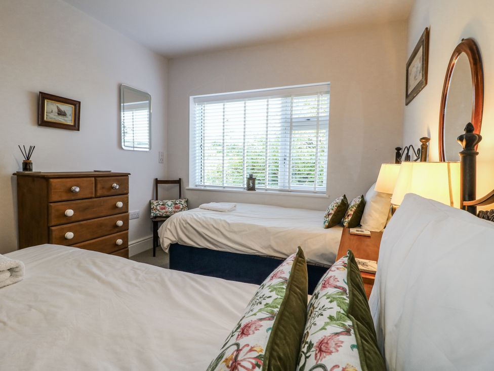 A bedroom with two beds and a dresser at The View @ Orchard View in Hognaston