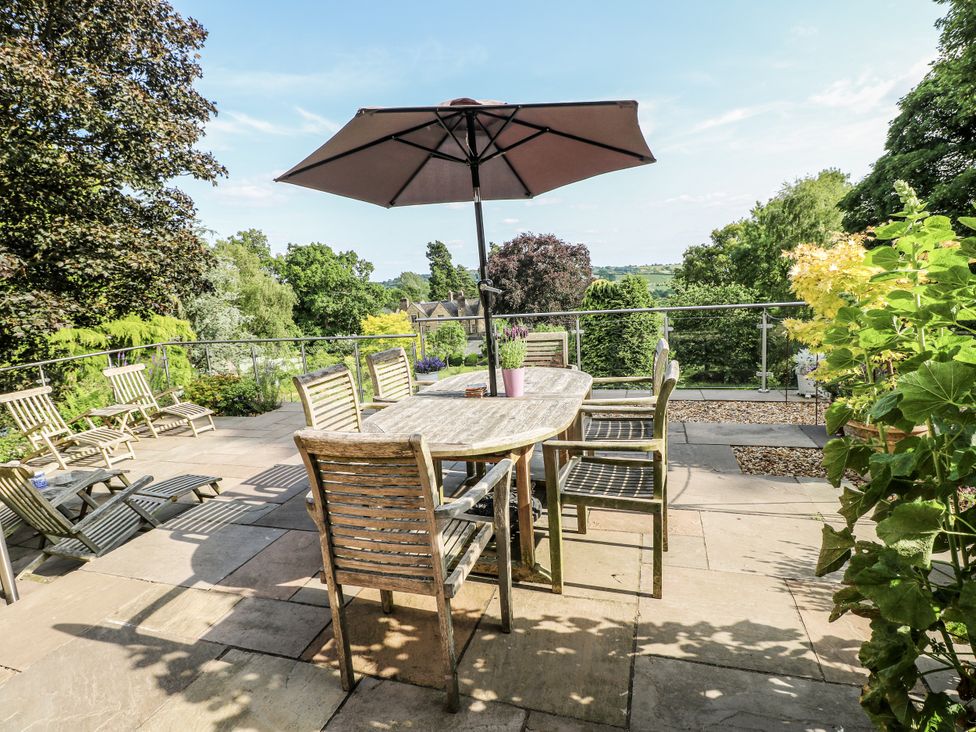 An outdoor dining area with a table and chairs at The View @ Orchard View in Hognaston