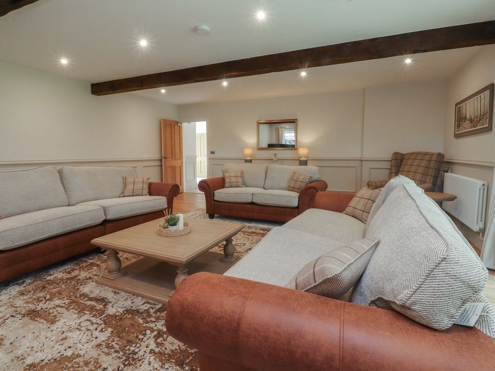 A living room with sofas and a coffee table at Alston House