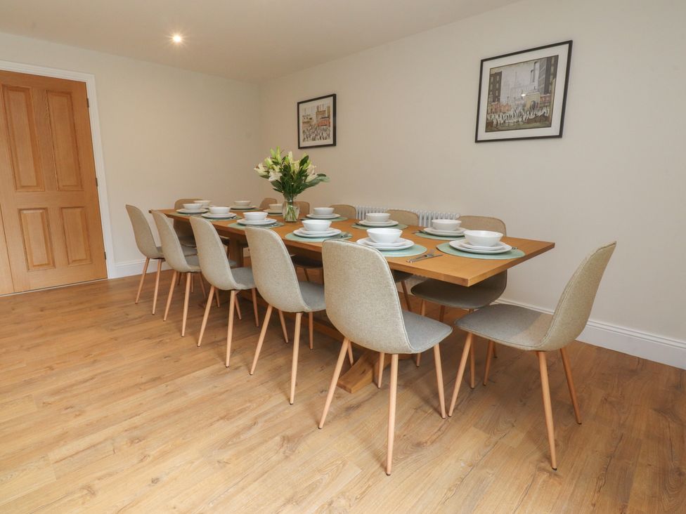A dining room with a table set for dinner at Alston House 