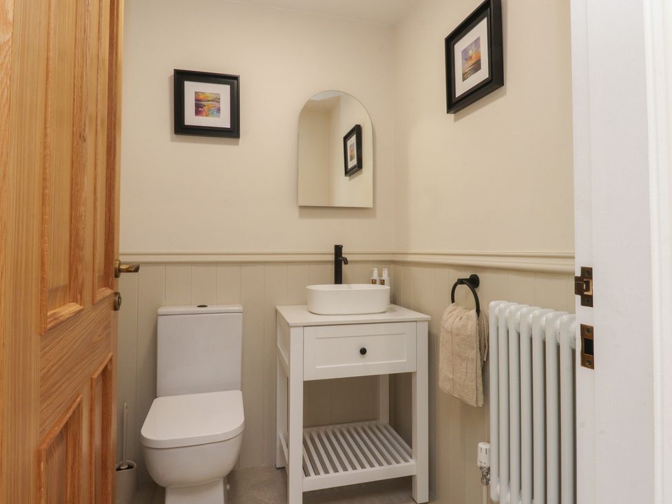 A bathroom with a toilet and wash basin at Alston House