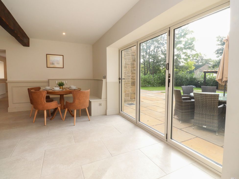 A dining room with a table and chairs at Alston House