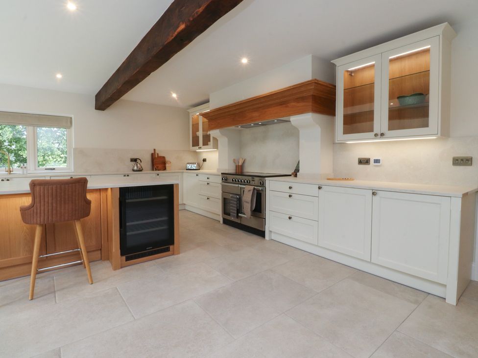 A kitchen with countertops and appliances at Alston House