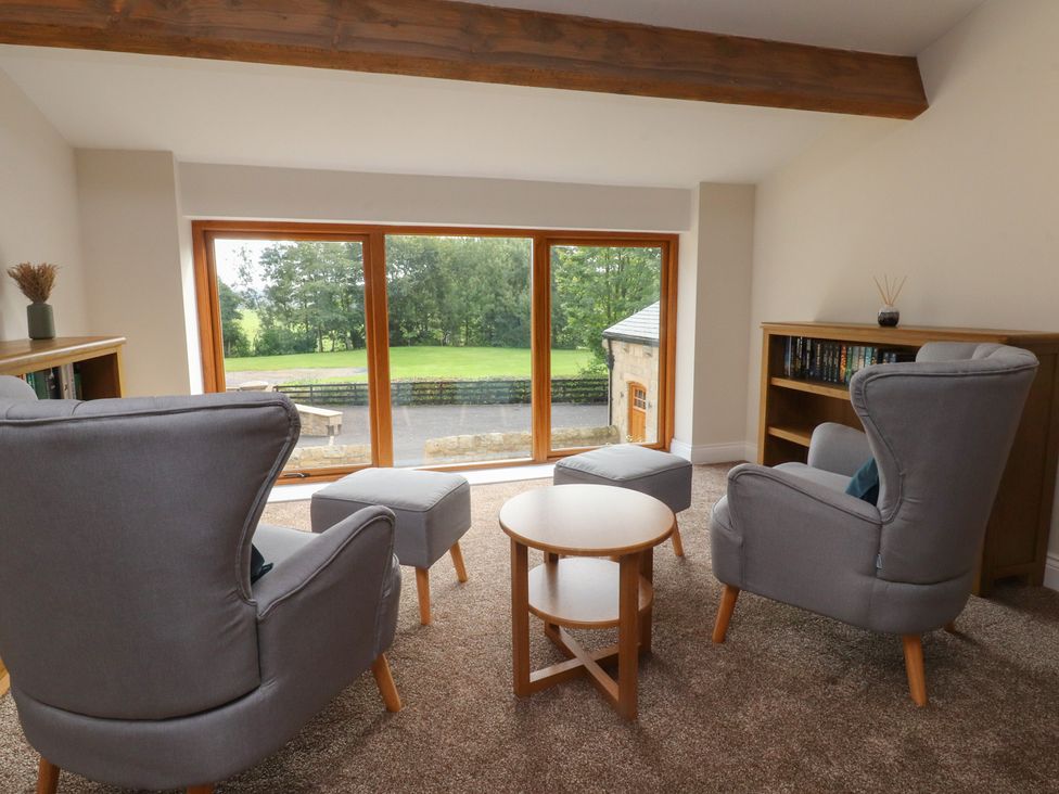A living room with a view and seating at Alston House