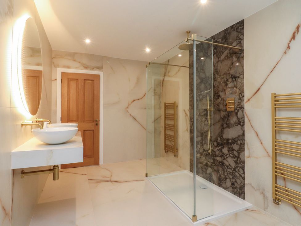 A bathroom with a shower and sink at Alston House