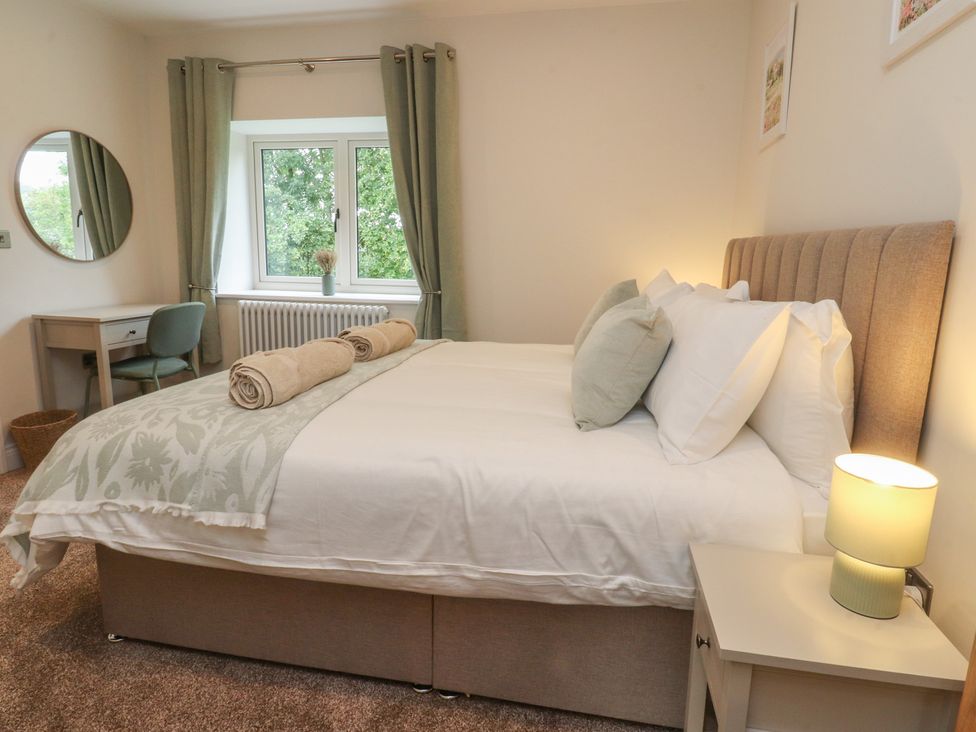 A bedroom with a bed and desk at Alston House 