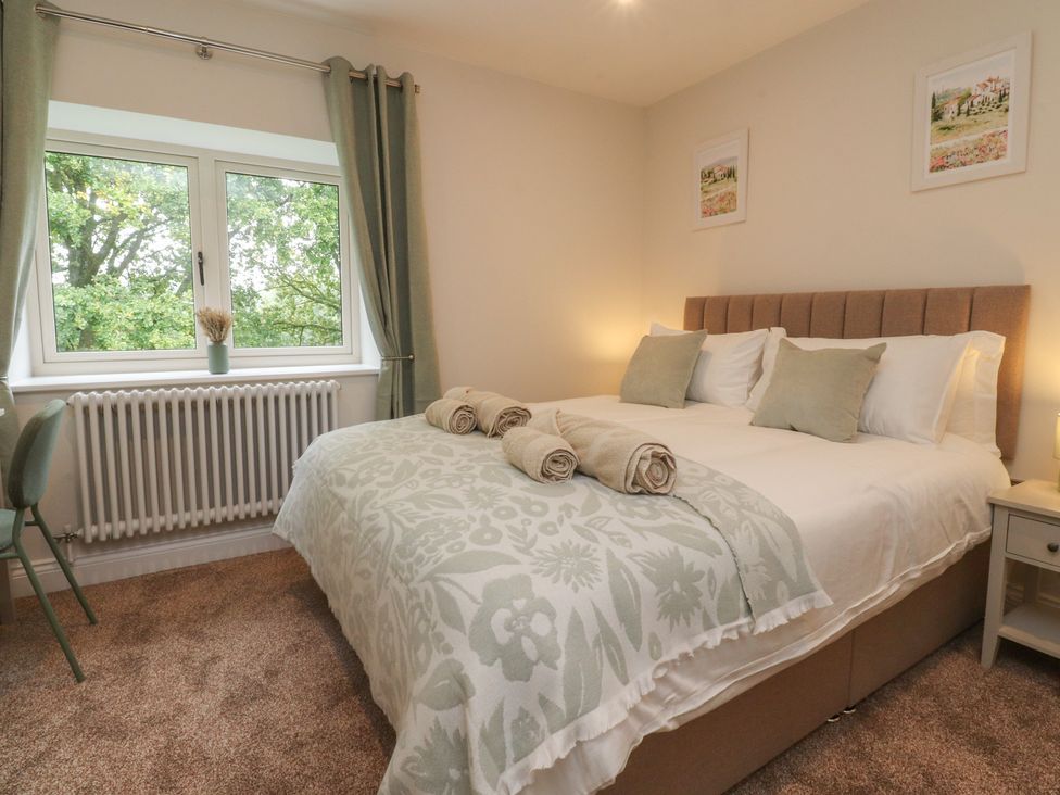 A bedroom with a bed and window at Alston House
