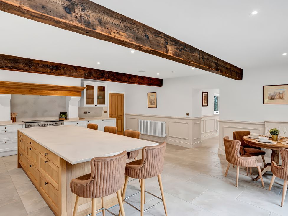 A kitchen with a large island and dining area at Alston House in Longridge