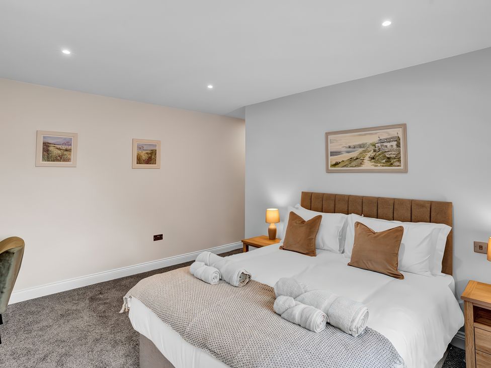 A bedroom with a bed and side tables at Alston House Longridge