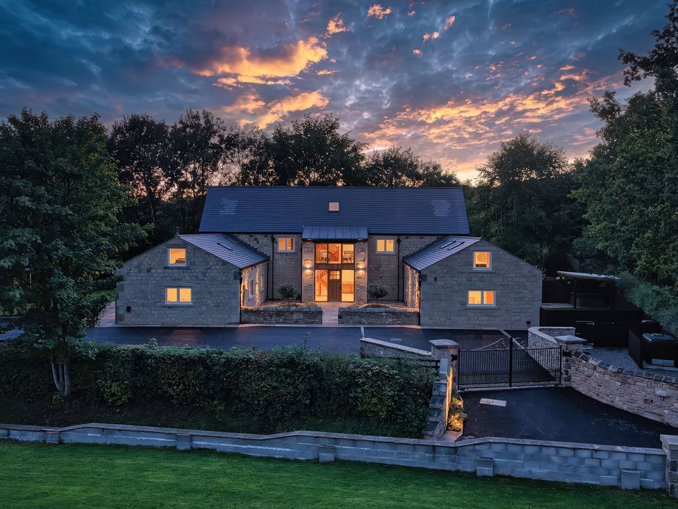 A house with a driveway and garden at Alston House Longridge