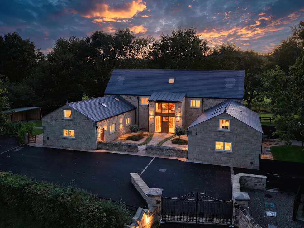 A house with a driveway and garden at Alston House in Longridge