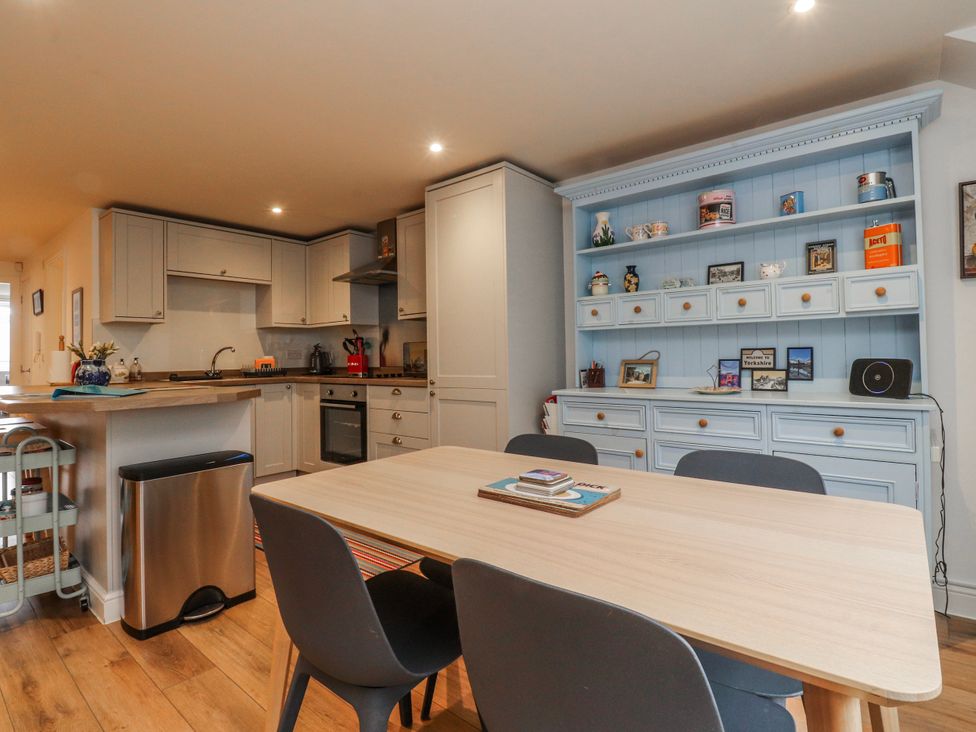 A kitchen with a table and chairs at Number 7 Canalside in Skipton