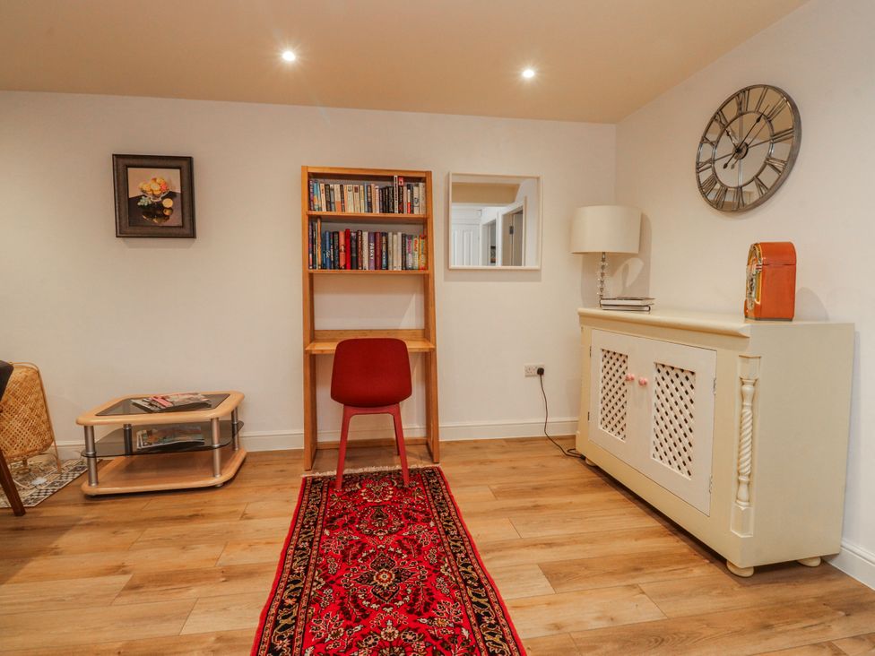 An office with a bookshelf and chair at Number 7 Canalside, Skipton