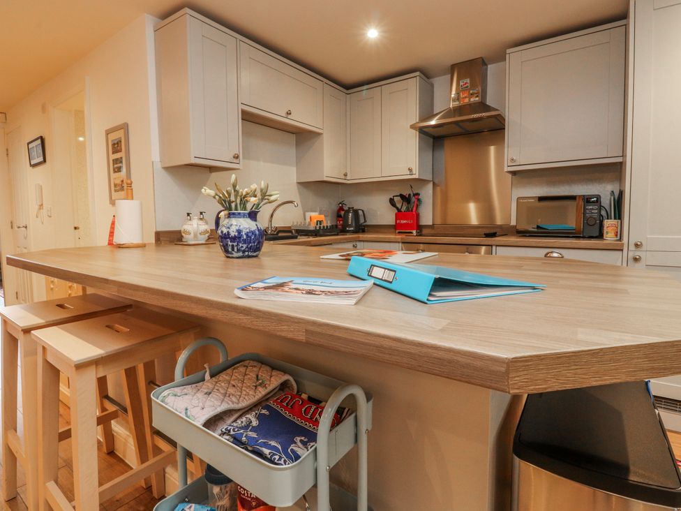 A kitchen with cabinets, sink, and countertop at Number 7 Canalside Skipton