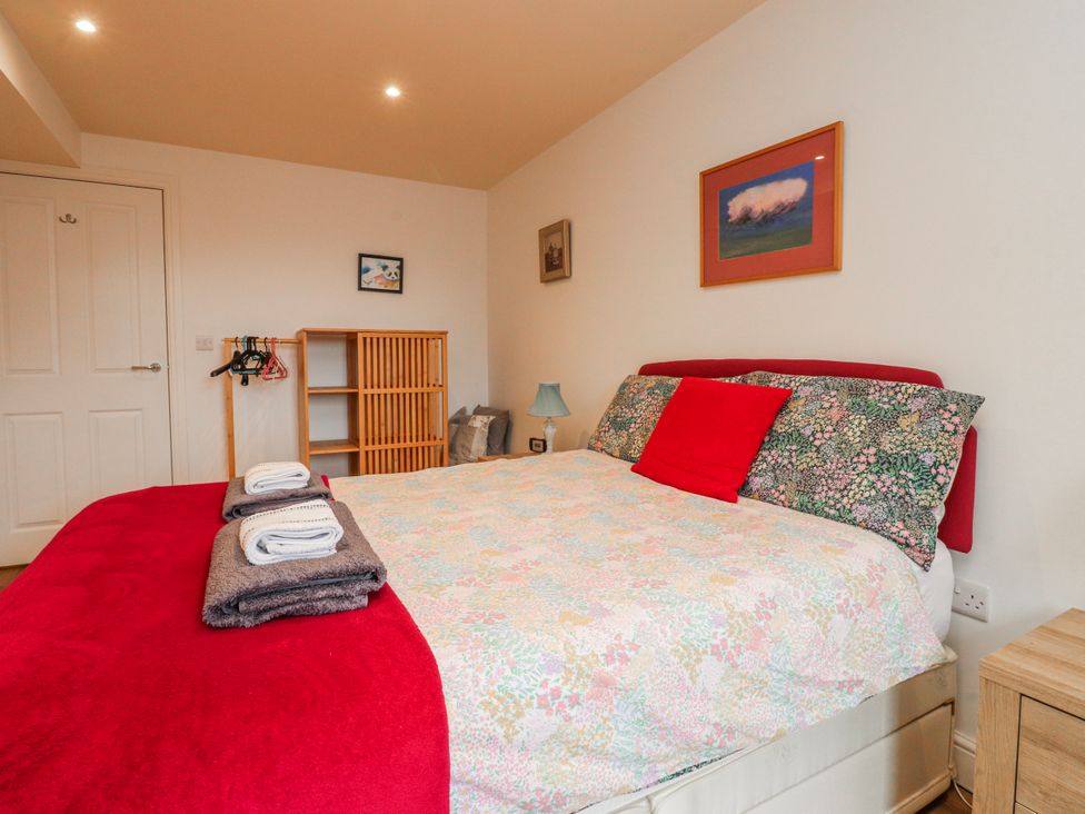 A bedroom with a bed and towels on it at Number 7 Canalside in Skipton