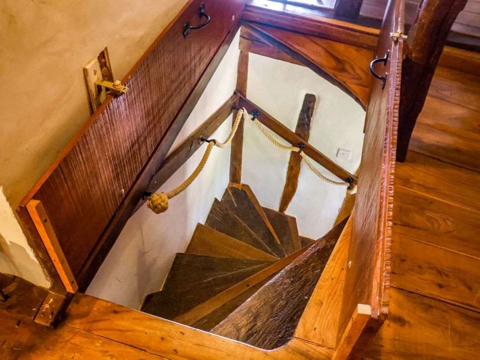 A wooden staircase leading down in Keirs Cottage Carlton Colville