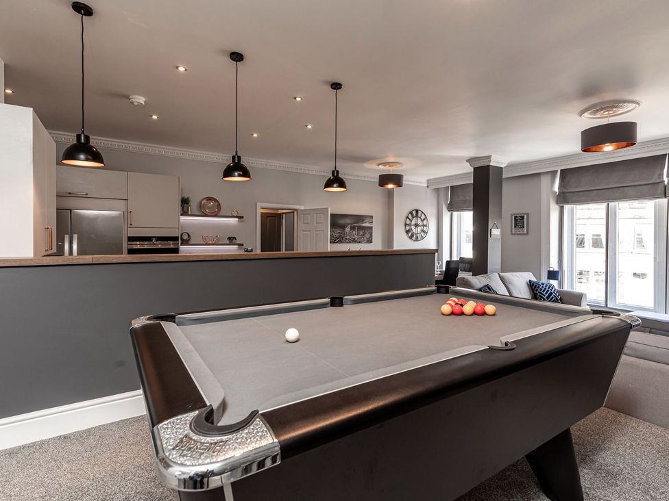 A game room with a pool table and kitchenette at The Crows Nest in Buxton