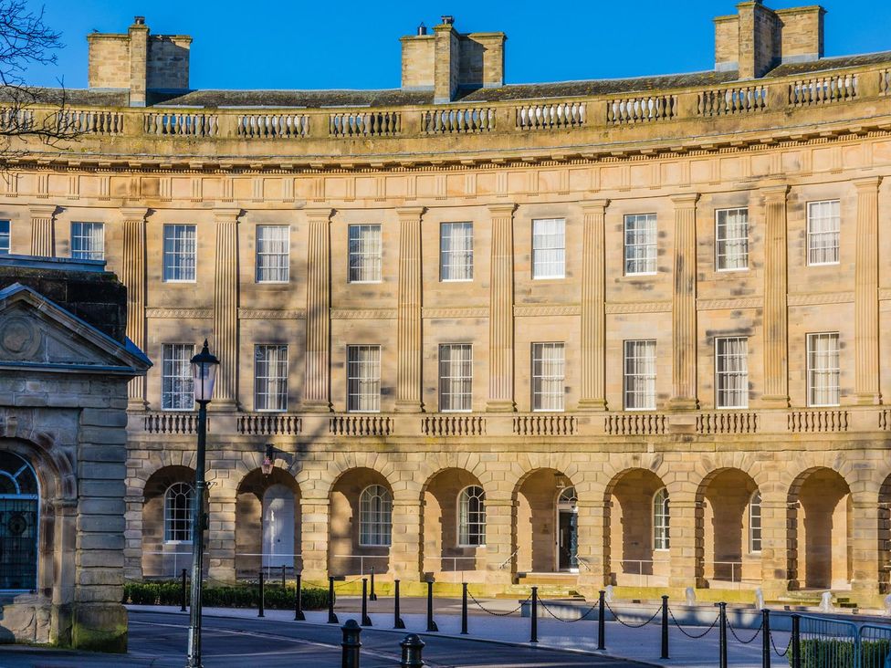 A building with columns and multiple windows at The Crows Nest in Buxton
