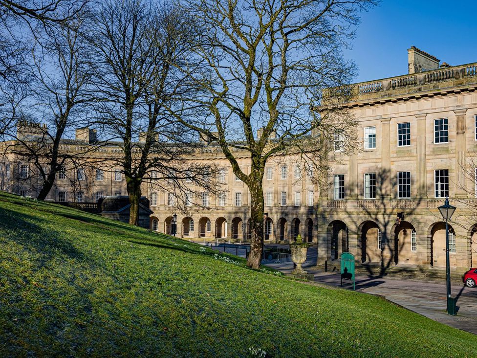 An outdoor area with buildings and trees at The Crows Nest in Buxton
