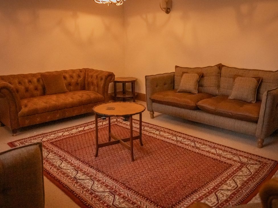 A living room with two sofas and a coffee table at Stud Farm House Bleddfa near Knighton