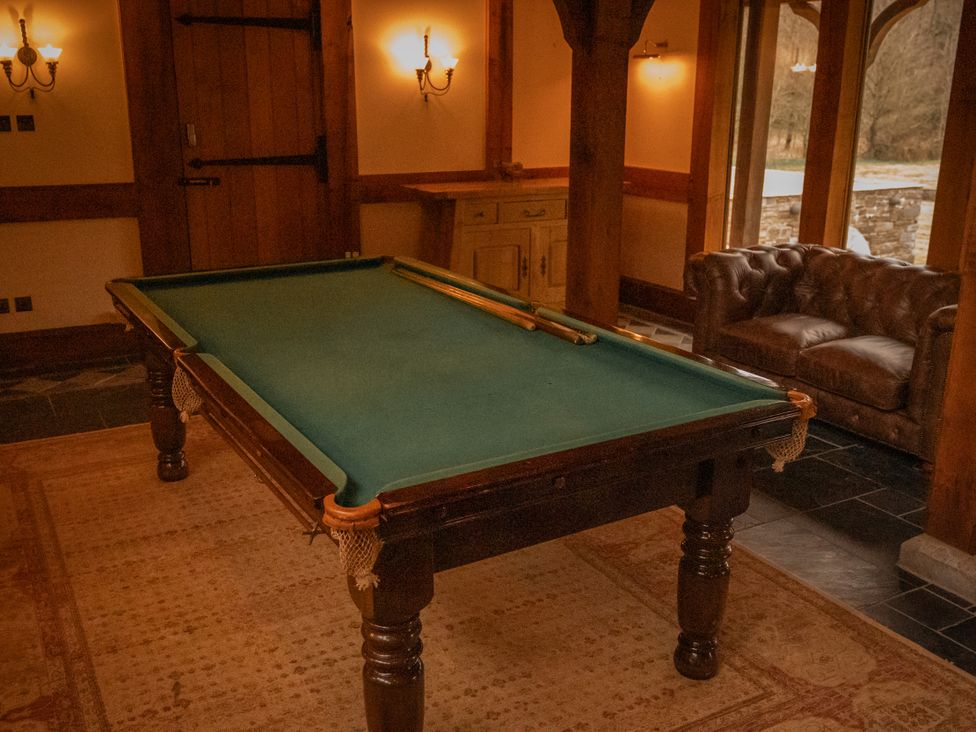 A pool table and a sofa at Stud Farm House Bleddfa near Knighton