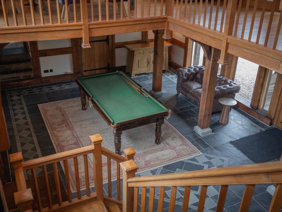 A recreation room with a pool table and a sofa at Stud Farm House Bleddfa near Knighton
