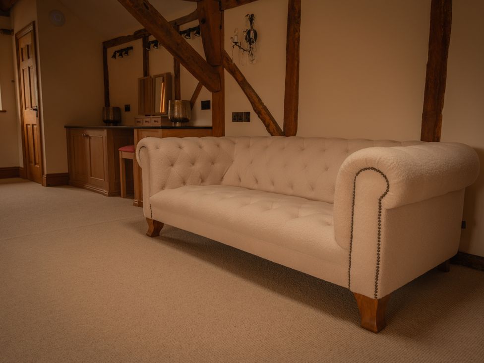 A sitting room with a sofa and table at Stud Farm House Bleddfa near Knighton