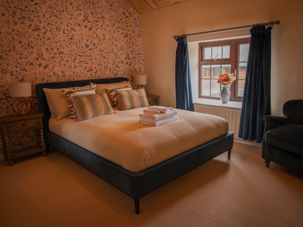 A bedroom with a bed and a window at Stud Farm House Bleddfa near Knighton