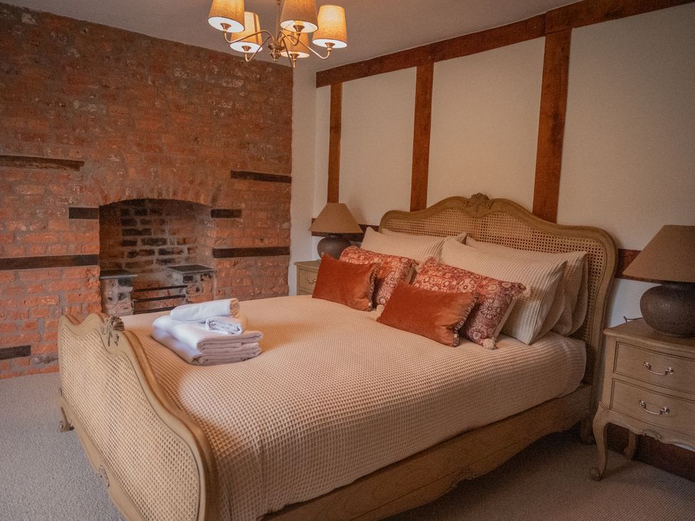 A bedroom with a bed and bedside tables at Stud Farm House Bleddfa near Knighton