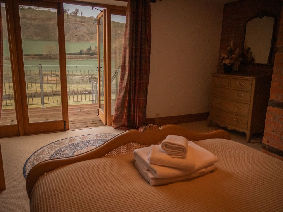 A bedroom with view and a bed at Stud Farm House Bleddfa near Knighton