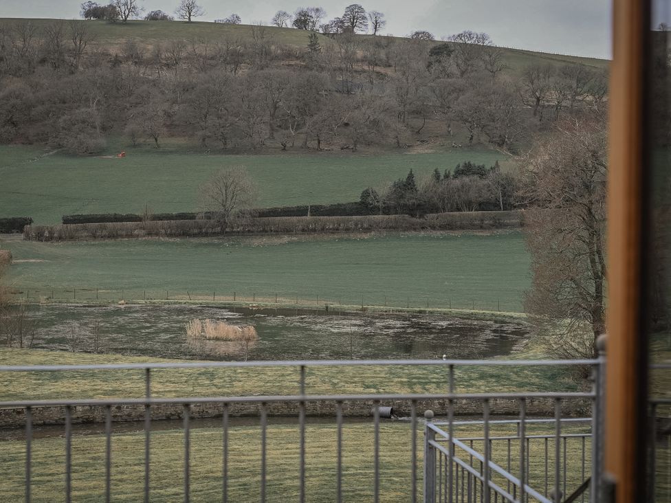 View of fields and a pond at Stud Farm House in Bleddfa near Knighton