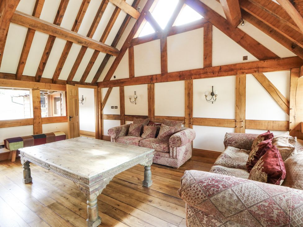 A living room with a coffee table and sofas at Stud Farm House Bleddfa near Knighton