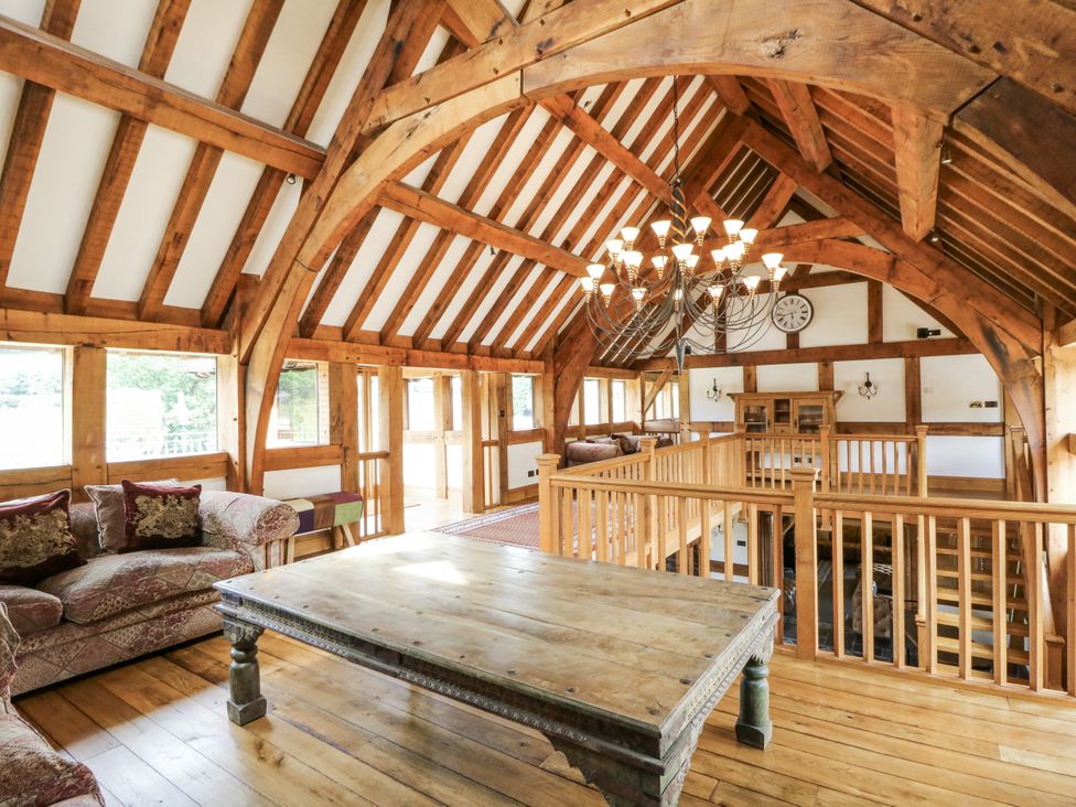 A living room with a table and sofa at Stud Farm House in Bleddfa near Knighton