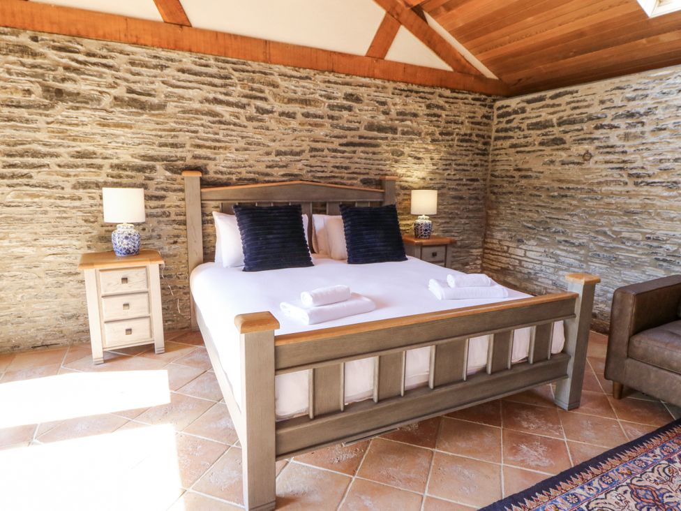 A bedroom with a bed and nightstand at Stud Farm House Bleddfa near Knighton