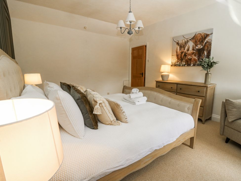 A bedroom with a bed and dresser at Stud Farm House Bleddfa near Knighton