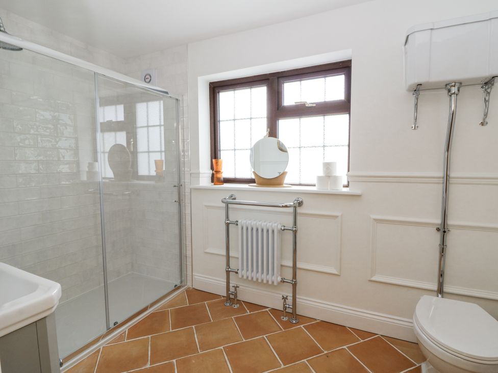 A bathroom with a shower and a toilet at Stud Farm House Bleddfa near Knighton