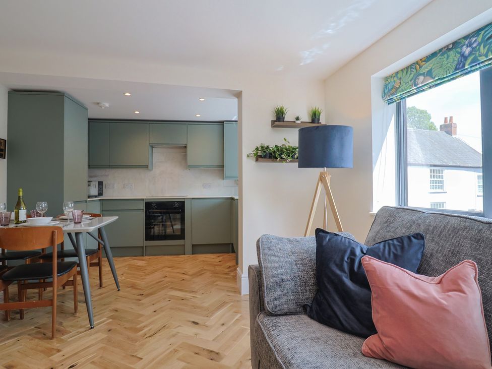 A kitchen with seating and modern appliances at 1 Mill Green Court in Lyme Regis