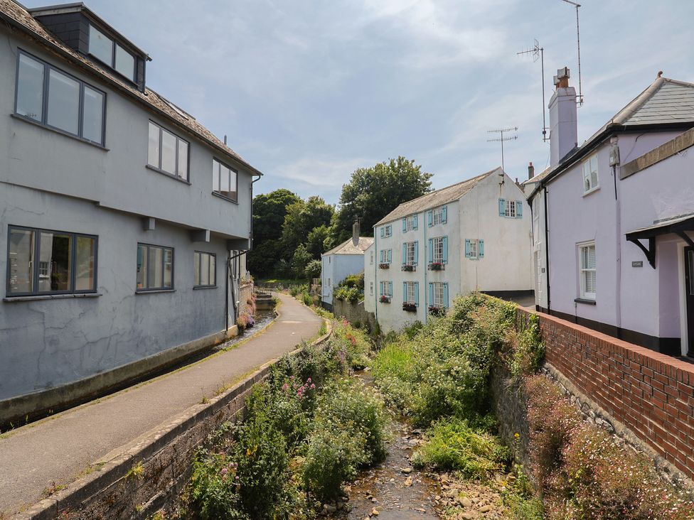 An outdoor scene with houses along a stream at 1 Mill Green Court Lyme Regis