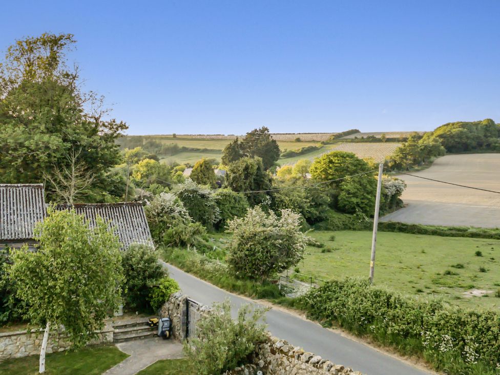 A view of fields and trees from a height at Tuckers Farm in Gatcombe