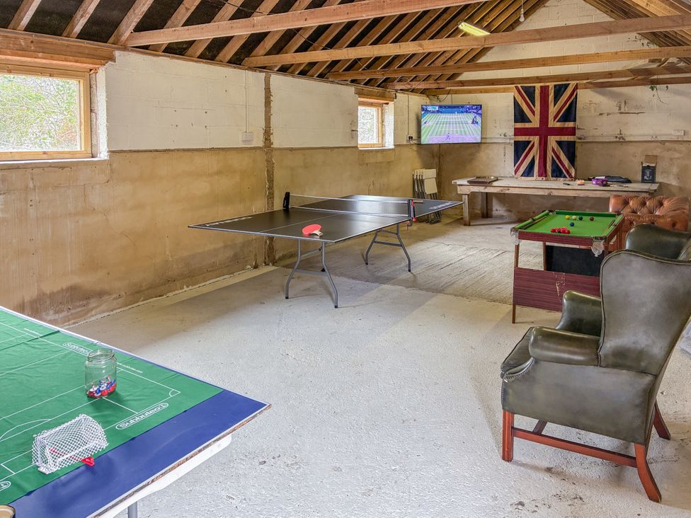 A game room with a table tennis table and pool table at Tuckers Farm in Gatcombe