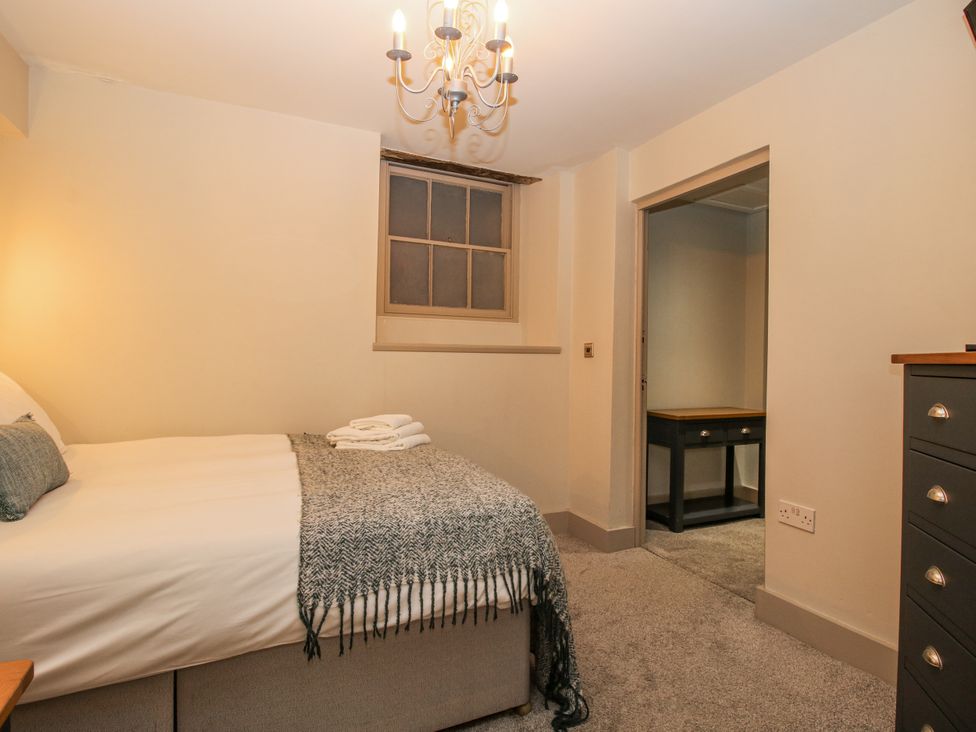 A bedroom with a bed and a desk at 1C College Hill in Shrewsbury
