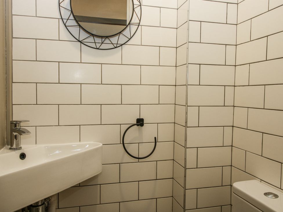 A bathroom with a sink and toilet at 1C College Hill in Shrewsbury