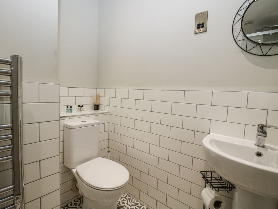 A bathroom with a toilet and sink at 1C College Hill, Shrewsbury