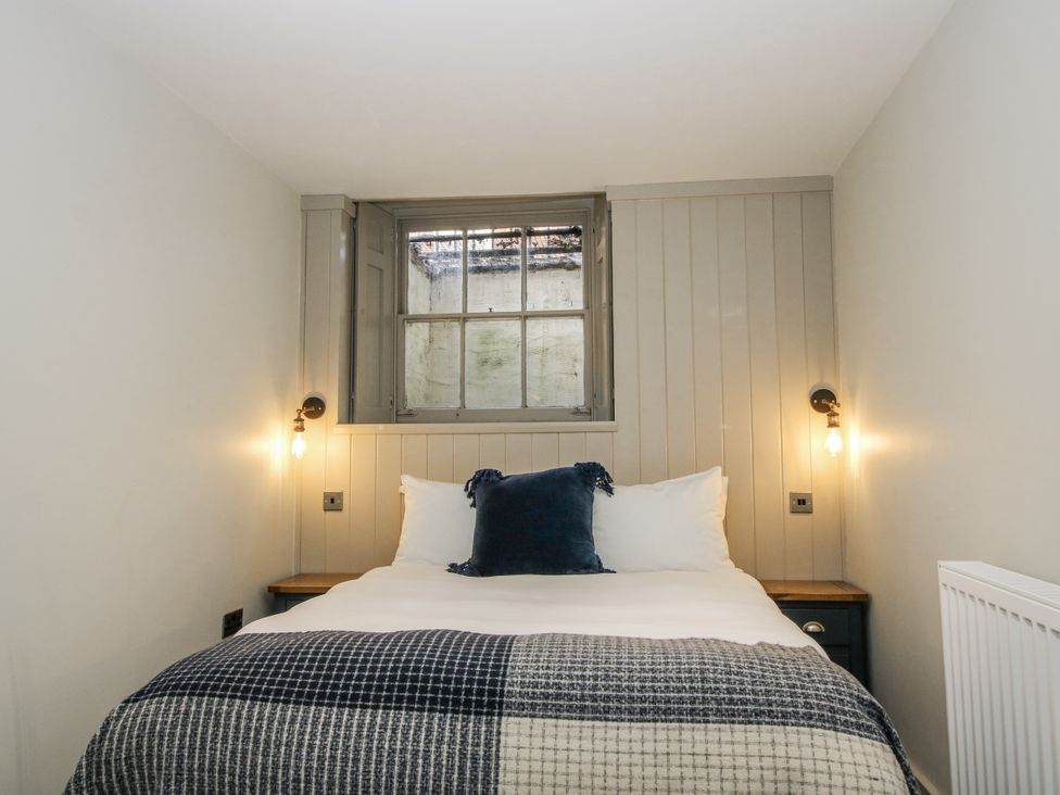 A bedroom with a bed and window at 1C College Hill in Shrewsbury