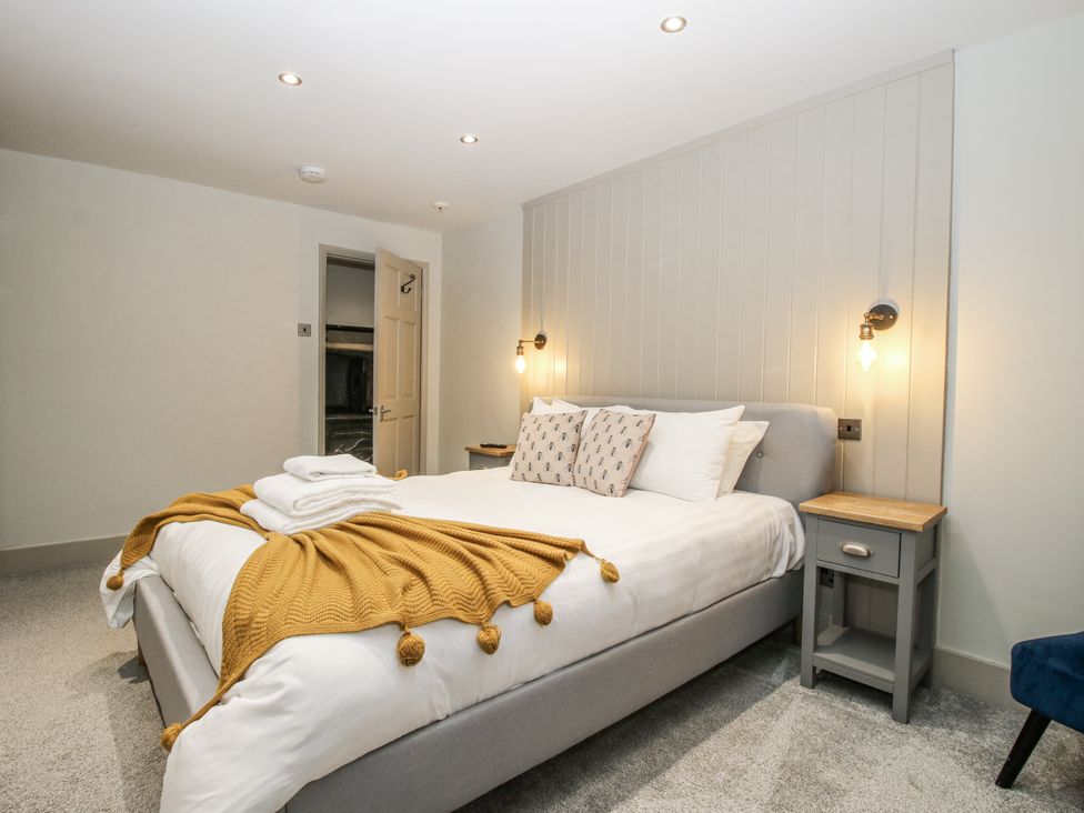 A bedroom with a bed and bedside table at 1C College Hill, Shrewsbury