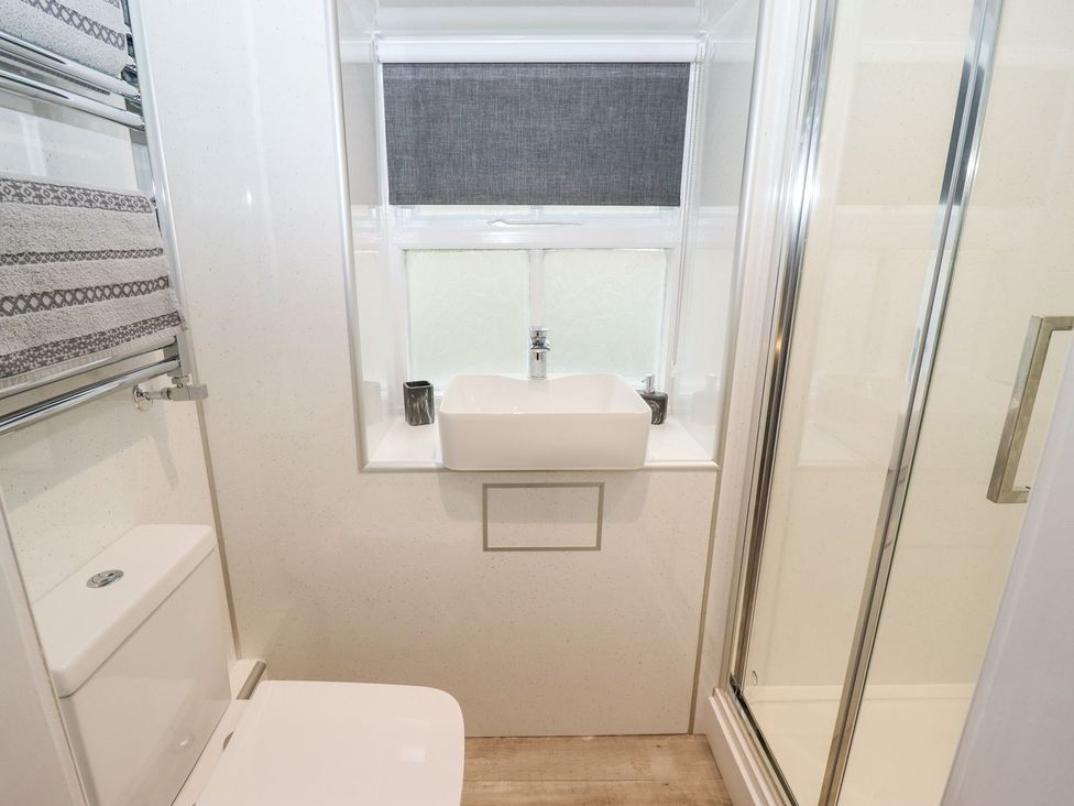 A bathroom with a sink and shower at Bobby's in Whitby